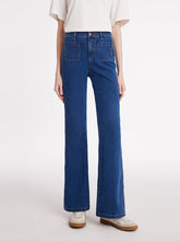 A lady wears flared jeans.